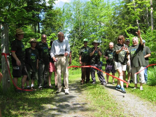 Members of the Kaaterskill Rail Trail Committee cut the ribbon opening the long-awaited trail from Mountain Top Historical Society in Haines Falls.